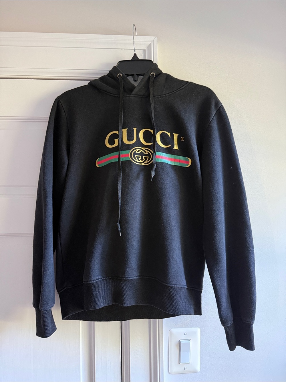 Black Hoodie with Gold Logo and Green-Red Stripe